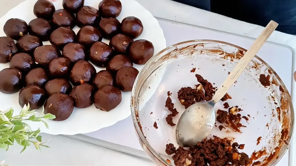 Formed no-bake chocolate biscuit balls before coating and decoration