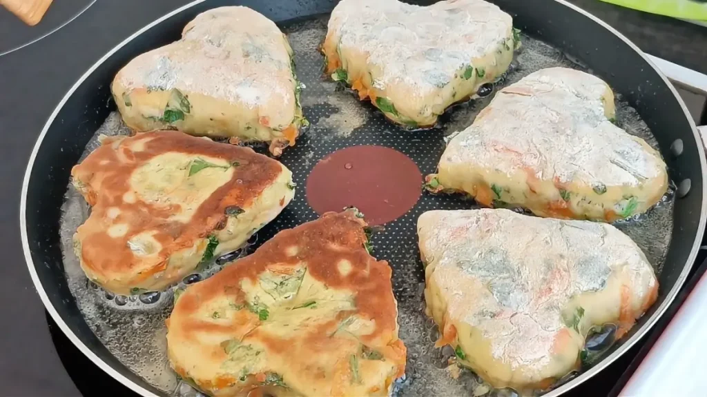 Healthy breakfast buns with zucchini, carrot, parsley, and cheese